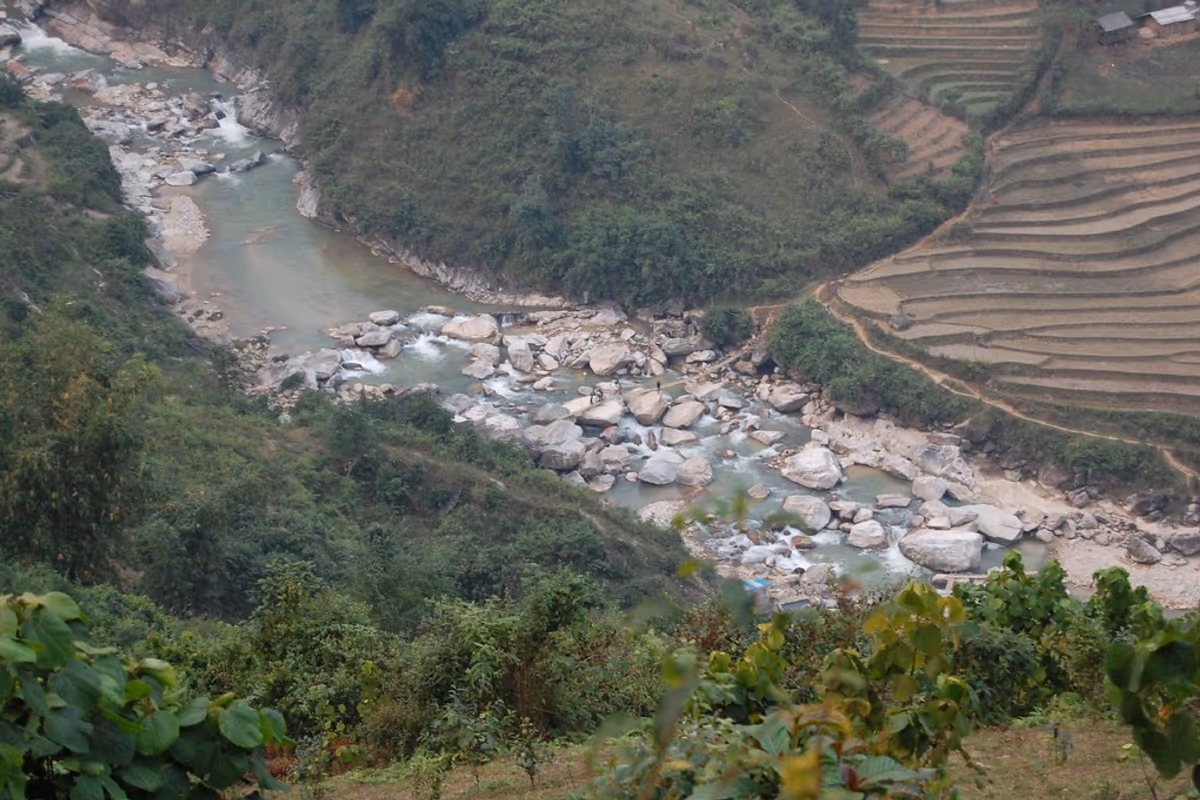The rocky stream and terraced hillside of the Ban Ho valley, Sapa