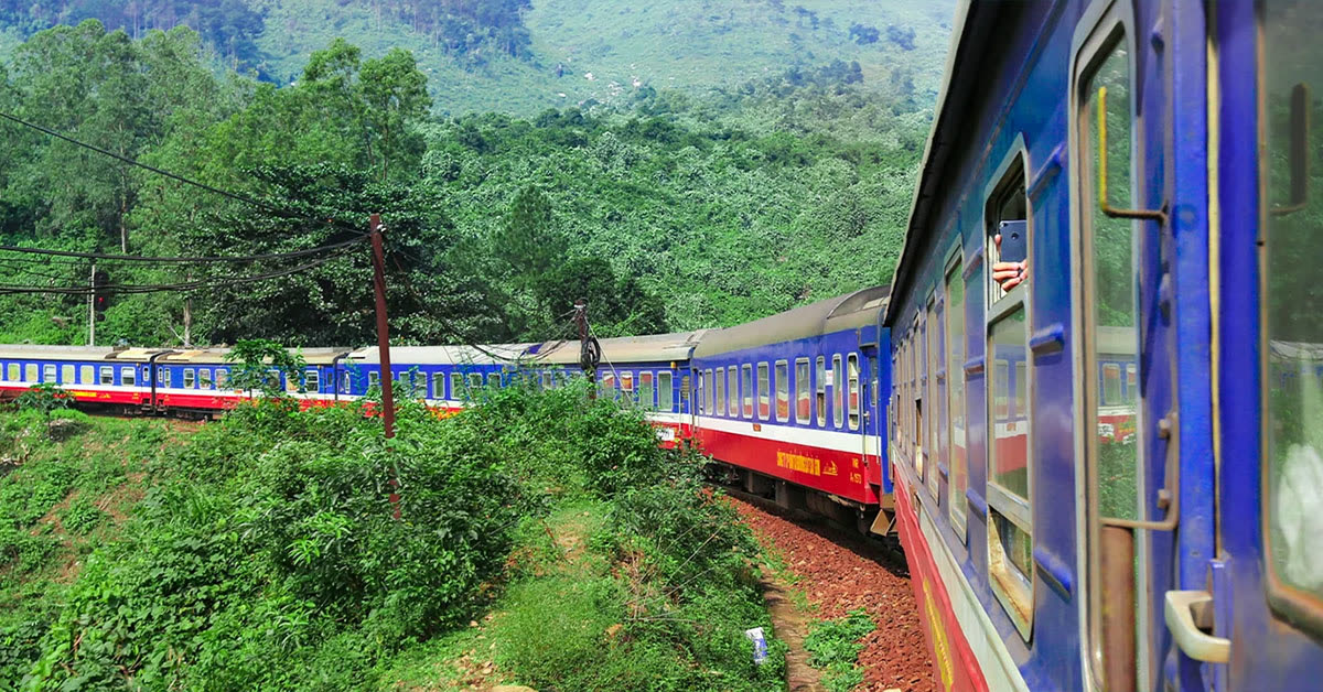 Chapa Express train on the Hanoi to Lao Cai line, curving through forested mountains — the overnight route to Sapa