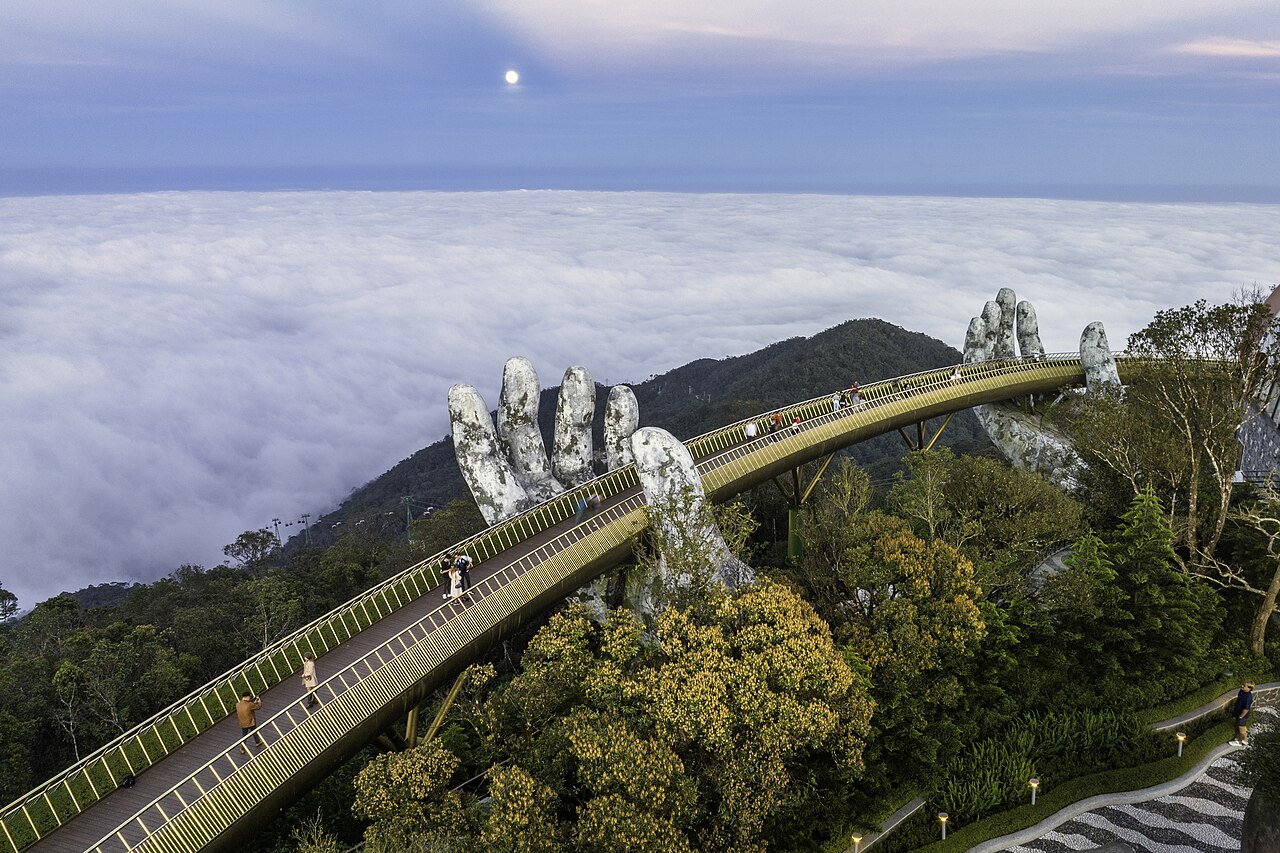 The Golden Bridge held up by two giant stone hands at Ba Na Hills near Da Nang, Vietnam