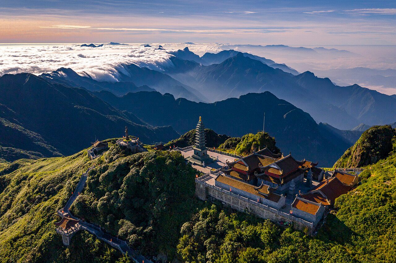 The summit complex of Fansipan above a sea of clouds