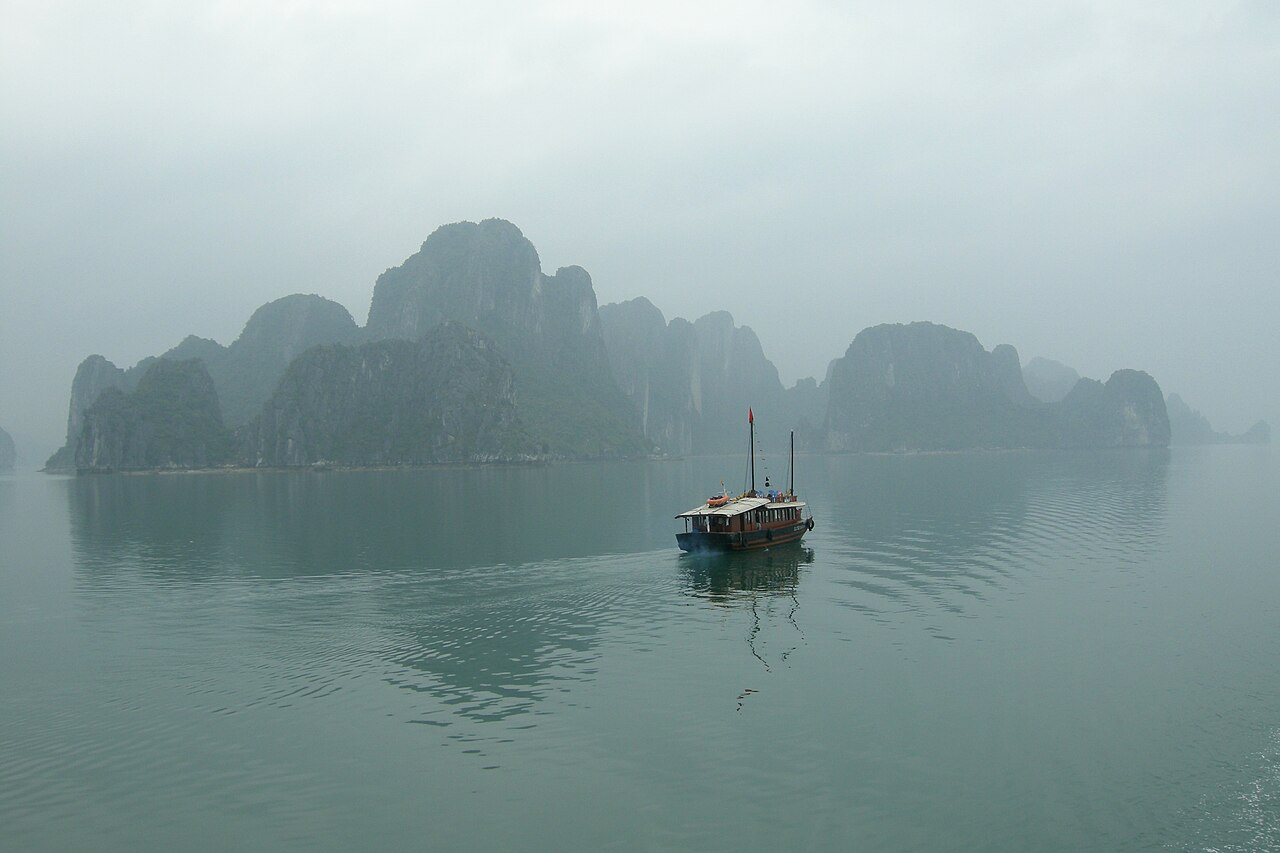 Junk boat among the karsts of Ha Long Bay, a highlight of the best time to visit Vietnam from India