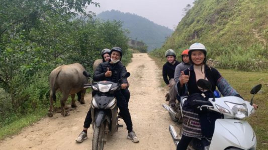 Riders on a motorbike on a mountain road on the route from Hanoi to Sapa
