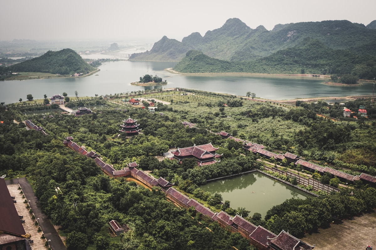 Aerial view of Bai Dinh Pagoda temple complex with lakes and karst hills in Ninh Binh Vietnam
