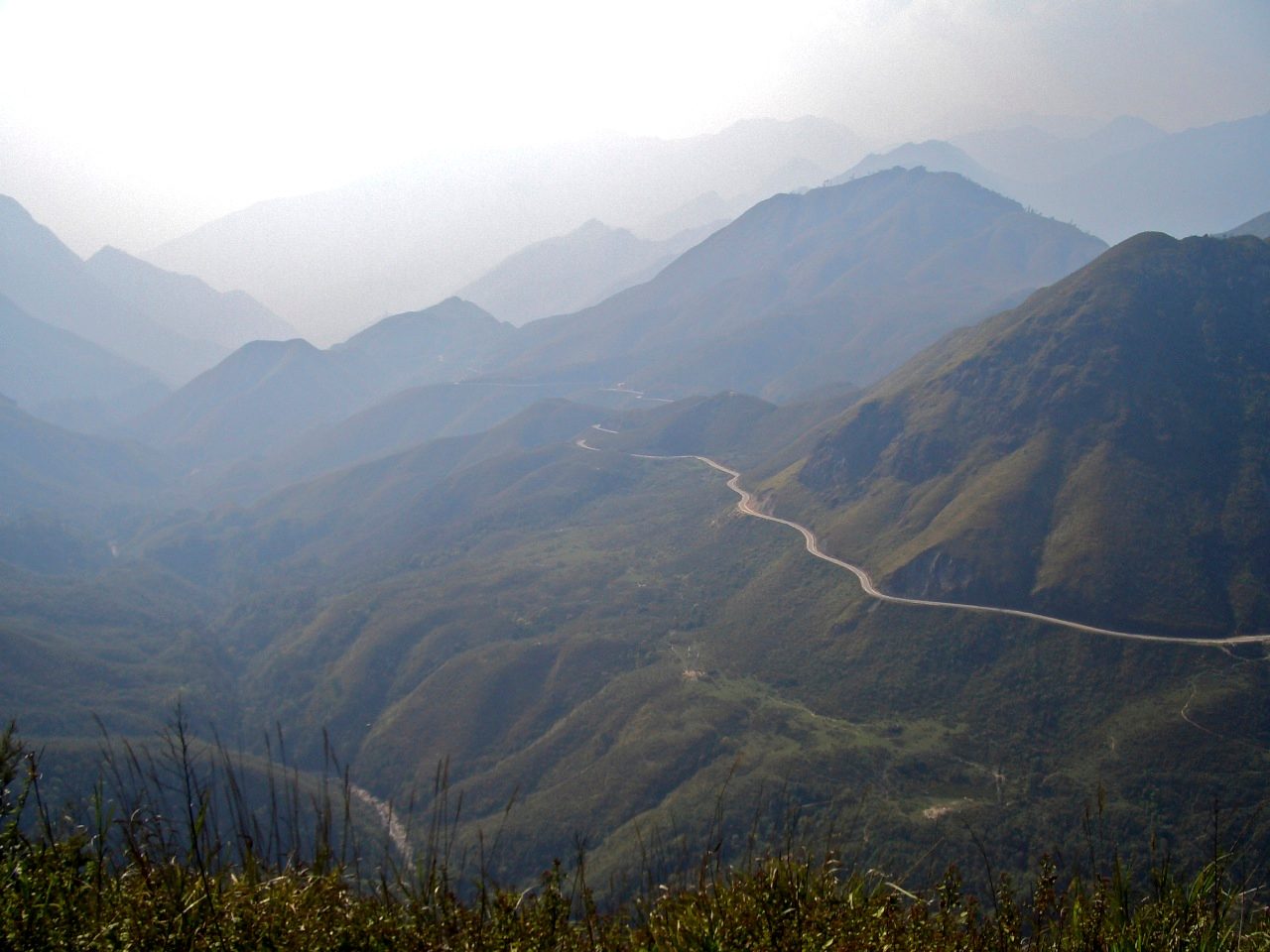 A winding mountain road on the route from Hanoi to Sapa