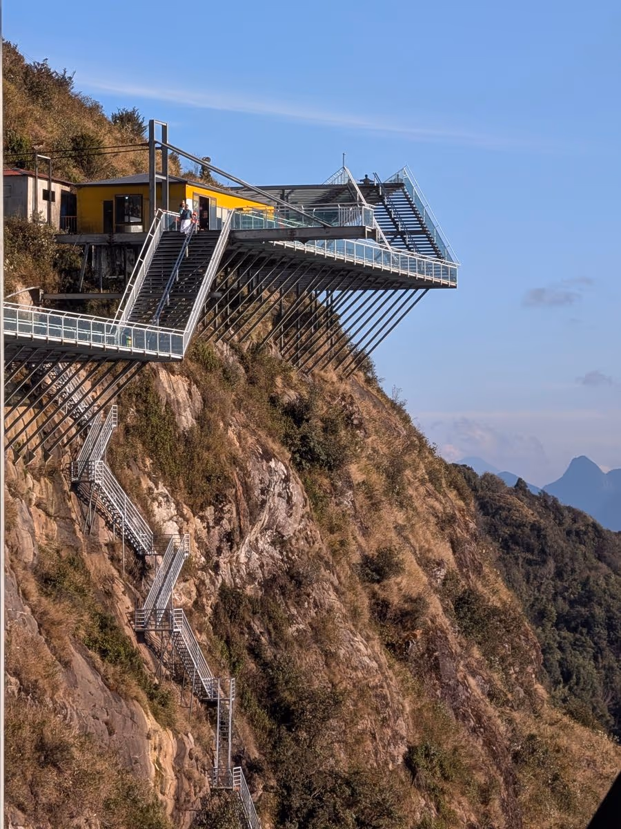 Glass walkway and viewing platform bolted to the cliff at Rong May Glass Bridge on O Quy Ho Pass, near Sapa