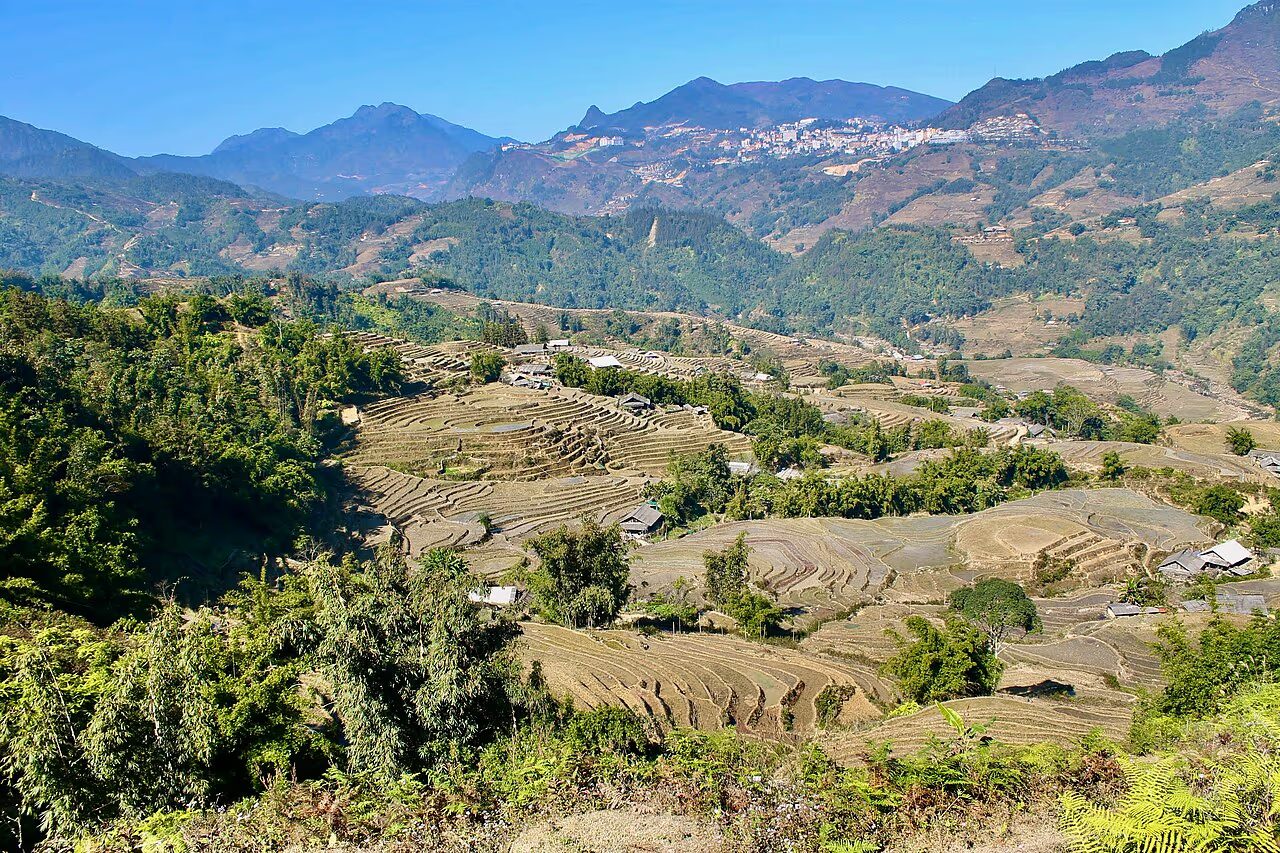 Clear view over the Sapa rice terraces and Muong Hoa Valley under blue sky