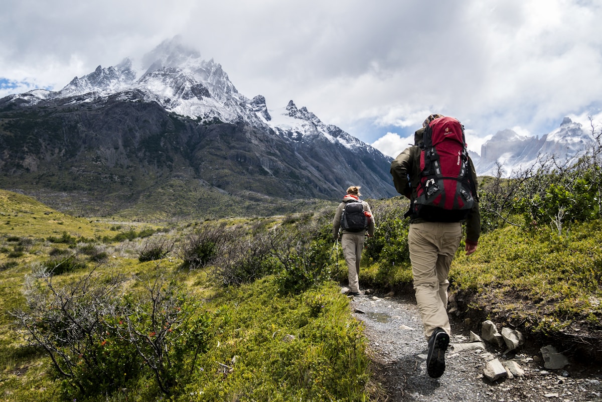 Local H'mong guide leading a trekking group through the Muong Hoa Valley