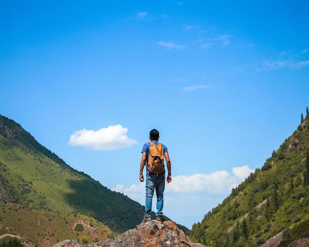 Behind A Man Is Trekking