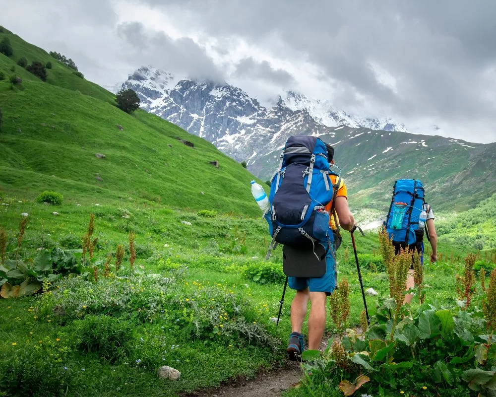 Mans With A Backpacks Are Trekking