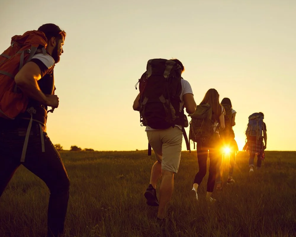 People Are Trekking In The Sun